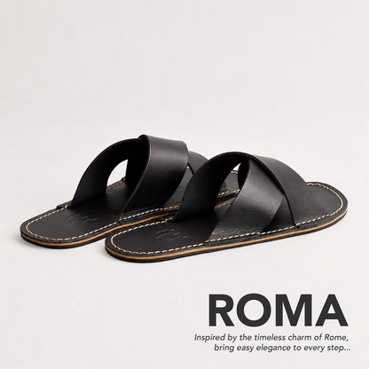 Nero | Flat leather sandals with debossed PLG three tree logo in sole, text reads "Roma. Inspired by the timeless charm of Rome, bring easy elegance to every step..."