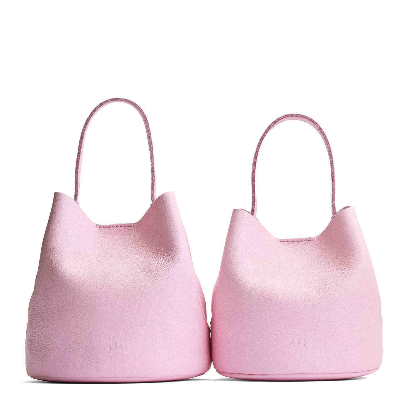 Pinkaboo | Size comparison image of two symmetrical leather bucket bags
