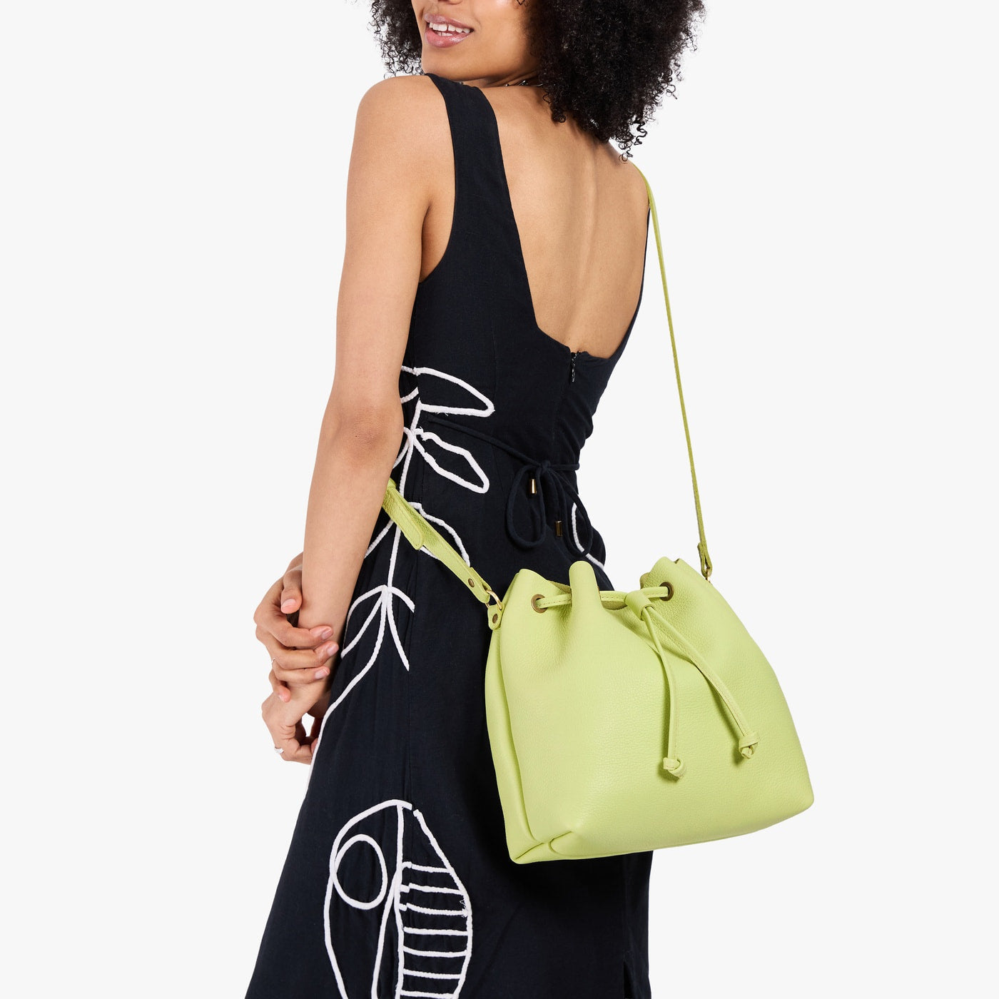 Shadow Lime*Large | Model wearing slouchy crossbody bag with drawstring closure