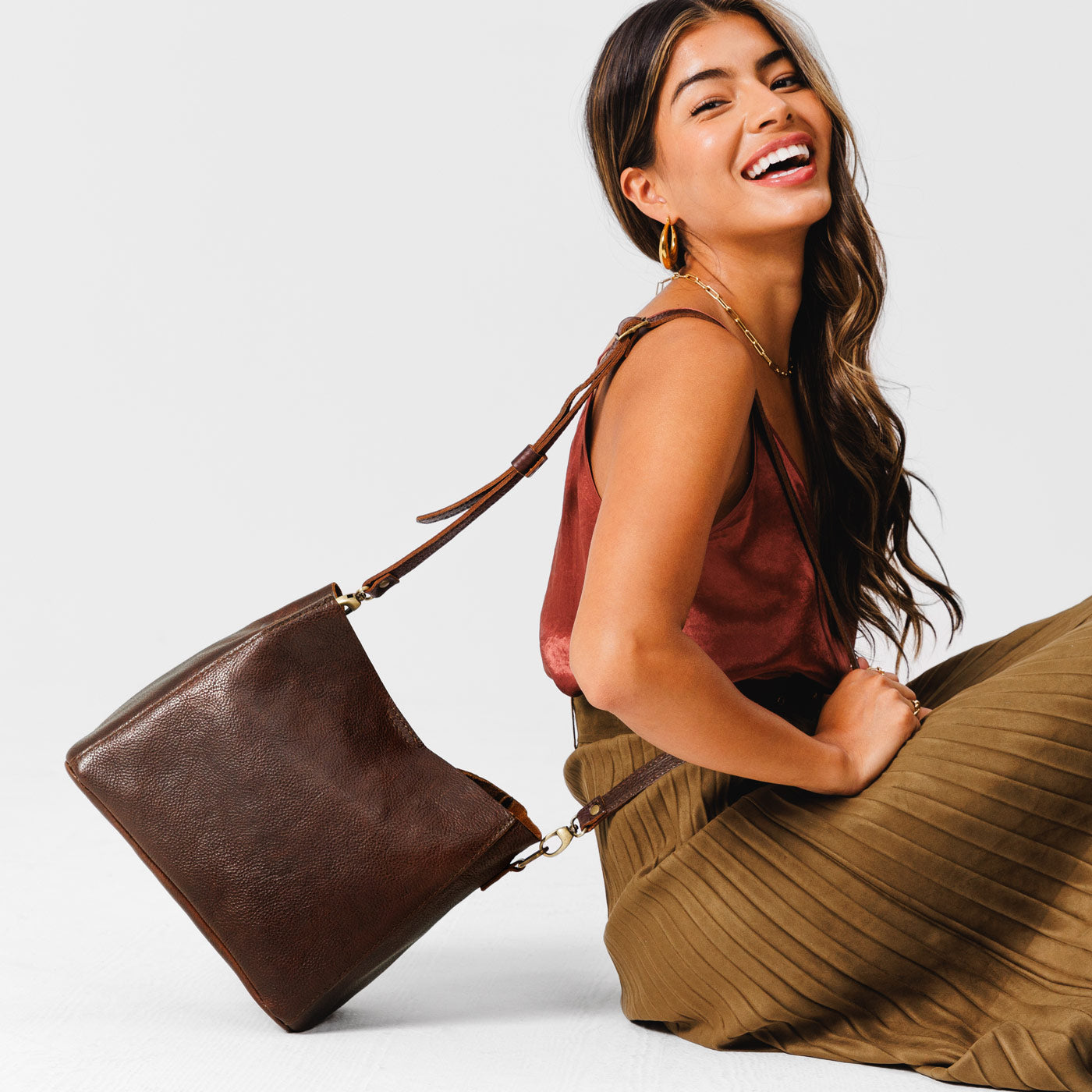 Coldbrew | symmetrical bucket bag with latch closure and removable crossbody strap