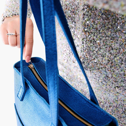Comet Blue*Zipper | Model holding medium Tote with dual shoulder straps and crossbody strap