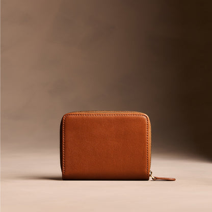 Vintage Tan | Wallet with card and storage pockets on a light brown background - back view