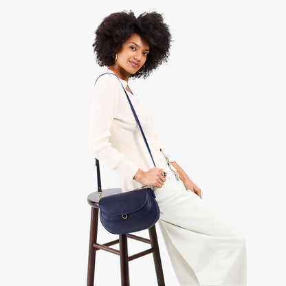 Cobalt*Large | Model wearing a leather Crossbody with a flap and magnetic closure