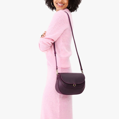Larkspur*Large | Model wearing a leather Crossbody with a flap and magnetic closure