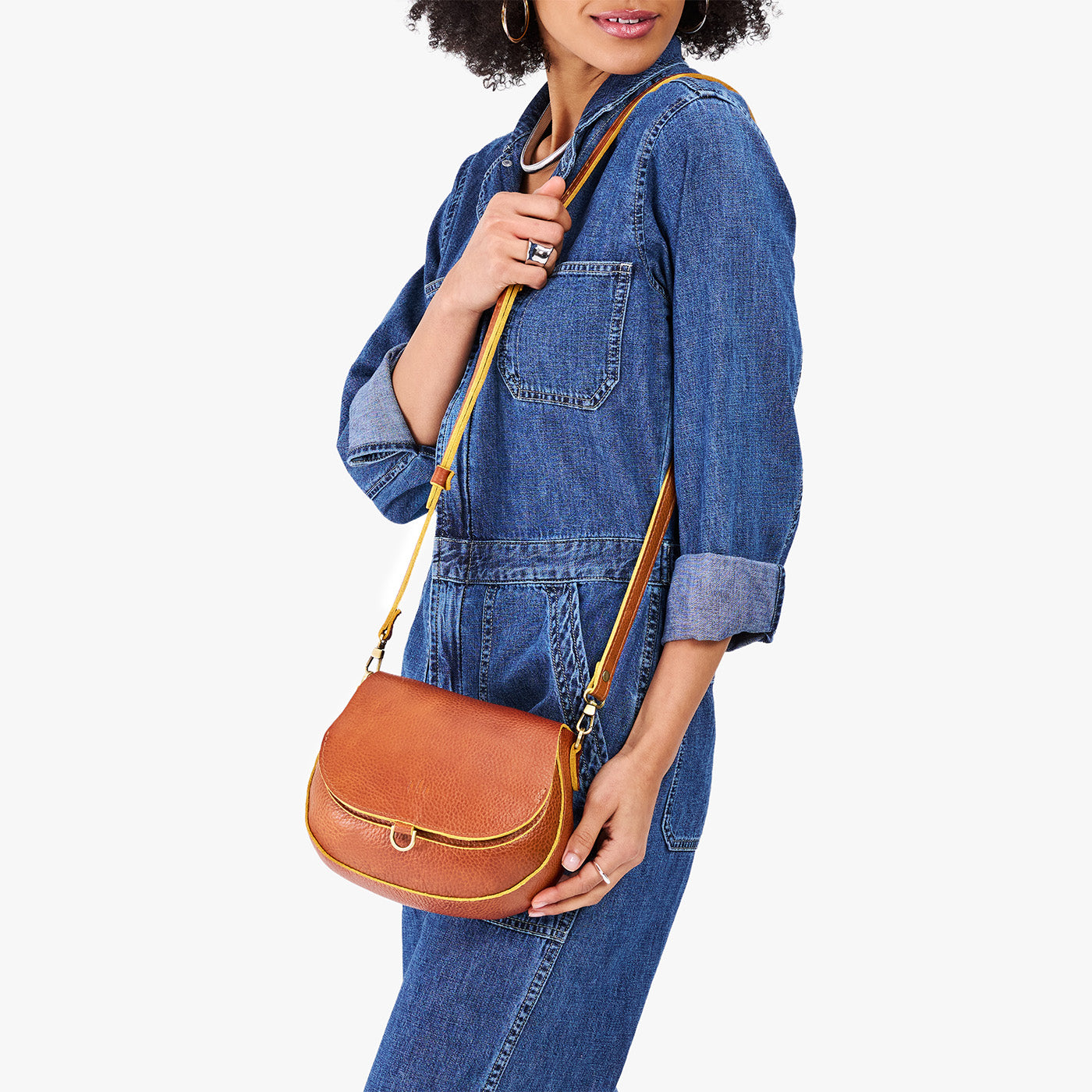 Sienna*Small | Model wearing a petite leather Crossbody with a flap and magnetic closure