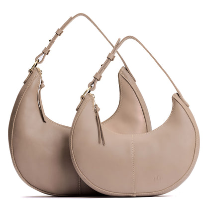 Stone | Crescent shaped shoulder bag with zipper closure and adjustable strap
