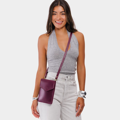 Lollipop | Model wearing slim, phone-shaped crossbody purse with magnetic closure