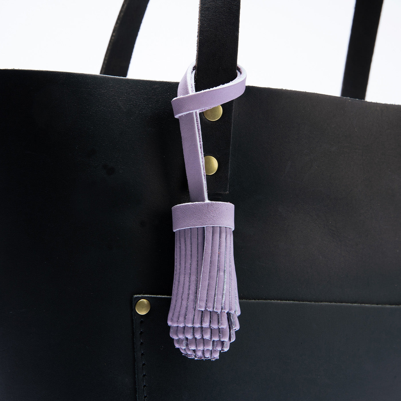 All Color: Lavender | Pom-pom style with tiered leather fringe