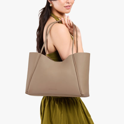 Stone*Large | Model holding a large rectangular tote bag